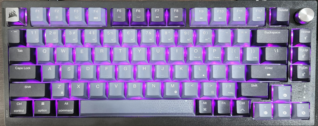 Close-up view of the Corsair K65 Plus Wireless keyboard keycaps with dye-sublimated PBT keys.