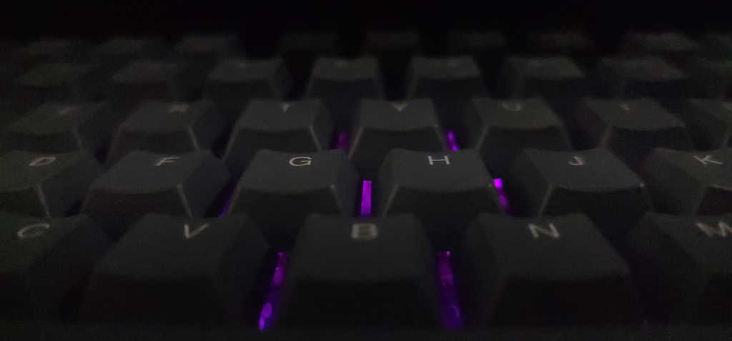 Close-up view of the Corsair K65 Plus Wireless keyboard keycaps with dye-sublimated PBT keys.