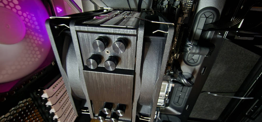 Installed ID-COOLING SE-214-XT PLUS CPU cooler showing the brushed aluminum top cover.